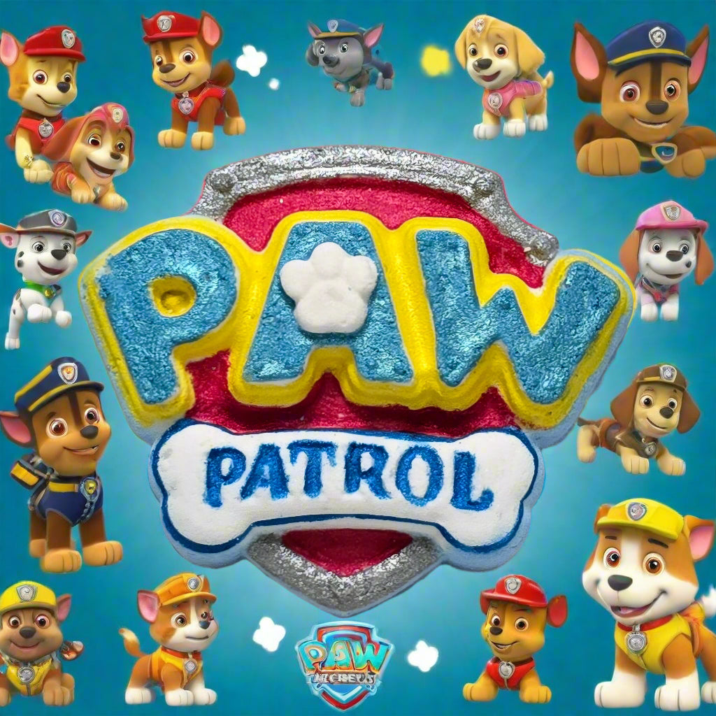 Topher’s Beard and Soap Co. Paw Patrol Bath Bomb – hand-painted bath bomb shaped like the Paw Patrol logo, displayed on a sky blue background surrounded by cartoon characters from the show, styled to capture a fun, kid-friendly bath time experience.