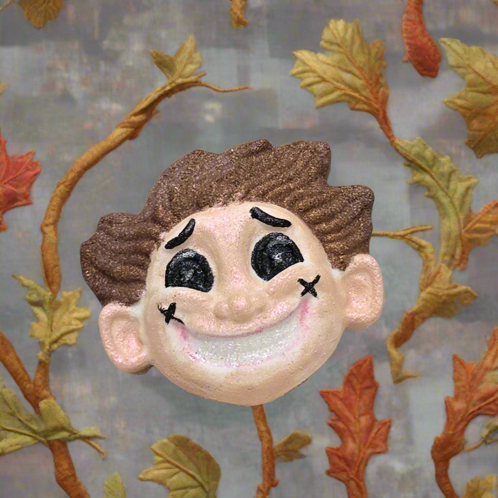 Topher’s Beard and Soap Co. Other Father Bath Bomb – hand-painted Coraline-inspired bath bomb styled with autumn leaves on a neutral surface, capturing a whimsical, fall-themed aesthetic.