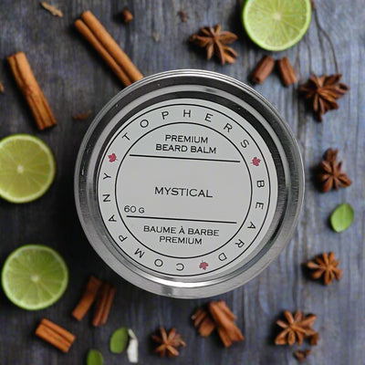 Topher's Beard and Soap Co. Mystical Beard Balm – 60 g metal tin with clean label design, surrounded by star anise, lime slices, cinnamon sticks, and herbs for a bold, spiced citrus vibe