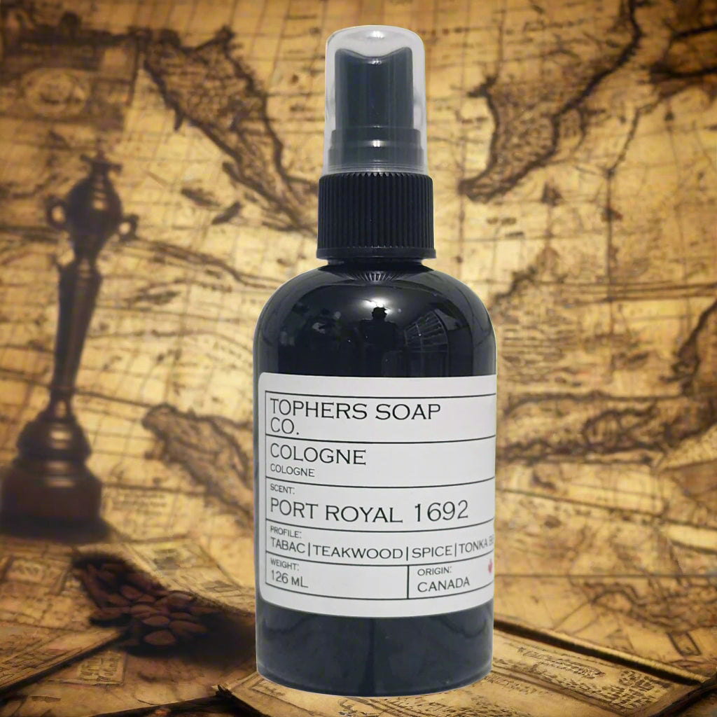 Topher's Beard and Soap Co. Port Royal 1692 Cologne – 126 ml black bottle with minimalist label featuring notes of tobacco, teakwood, spice, and tonka, styled against an antique nautical map for a bold, adventurous vibe