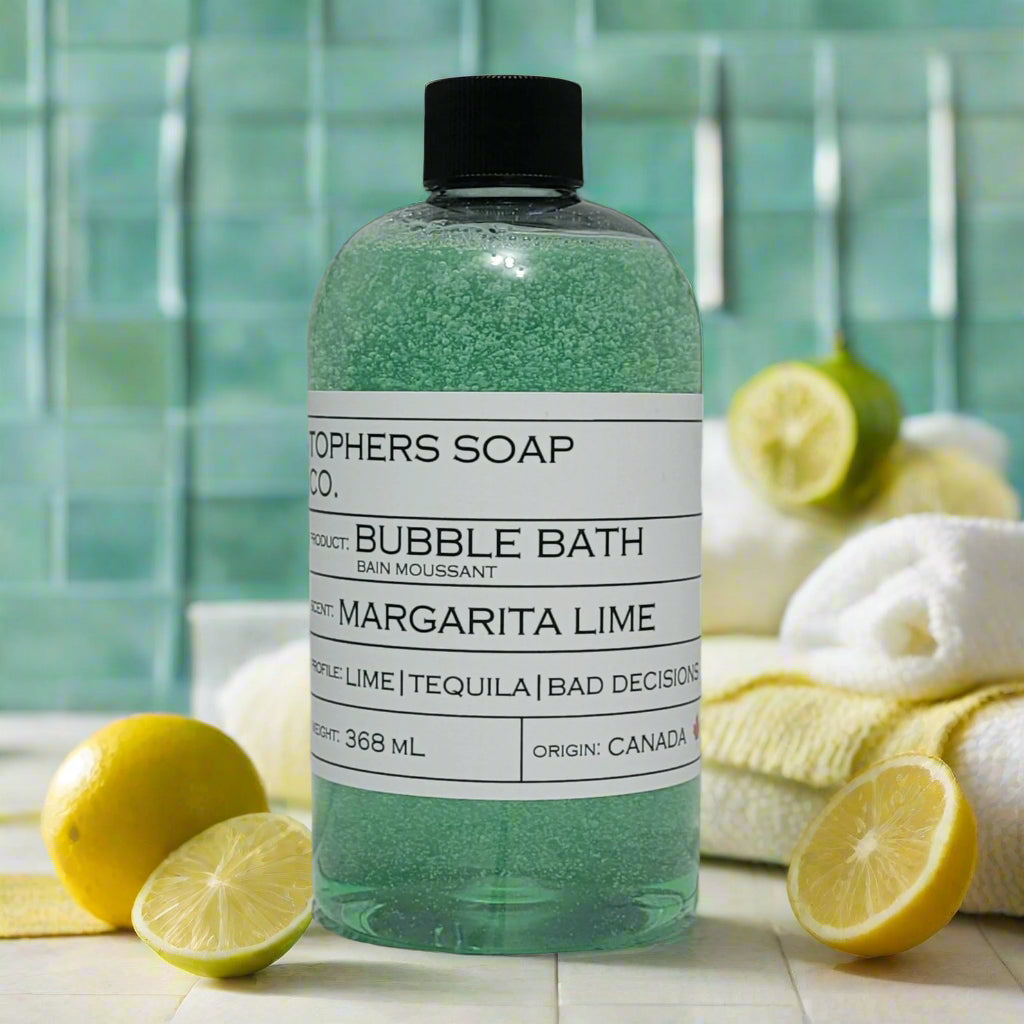 Topher's Beard and Soap Co. Margarita Lime Bubble Bath – 368 ml bottle of fizzy green bubble bath with lime, tequila, and citrus notes, styled with sliced lemons, towels, and a refreshing spa backdrop
