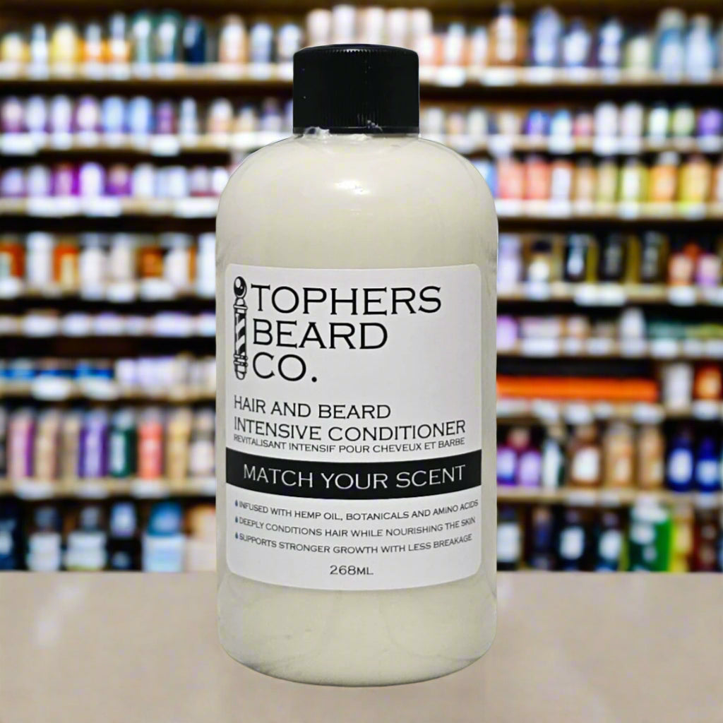 Topher’s Beard and Soap Co. Hair and Beard Intensive Conditioner – 268 ml bottle of customizable scent conditioner infused with hemp oil, botanicals, and amino acids, displayed on a store counter with colorful product shelves in the blurred background.