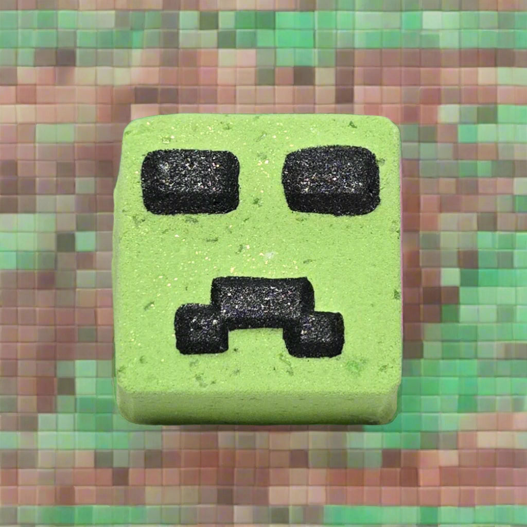 Topher’s Beard and Soap Co. Minecraft Slime Bath Bomb – hand-painted green square bath bomb inspired by the slime mob from Minecraft, displayed against a pixelated block-style background to reflect the game’s iconic aesthetic.