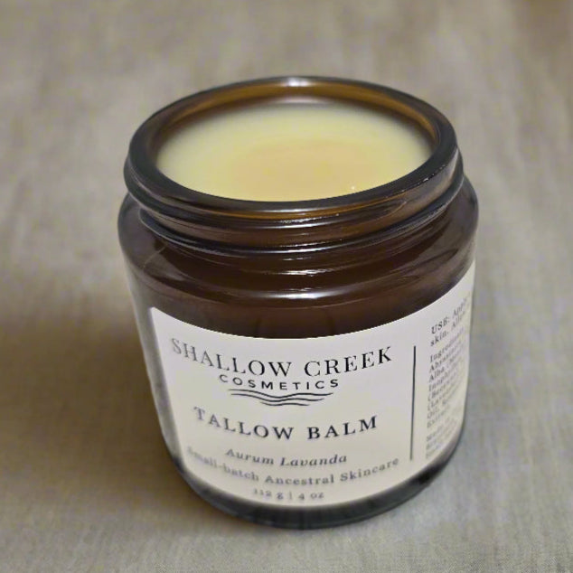 A full, open 112g jar of Shallow Creek Cosmetics Tallow Balm, Aurum Lavanda, an ancestral skincare product, revealing its solid, nourishing contents.