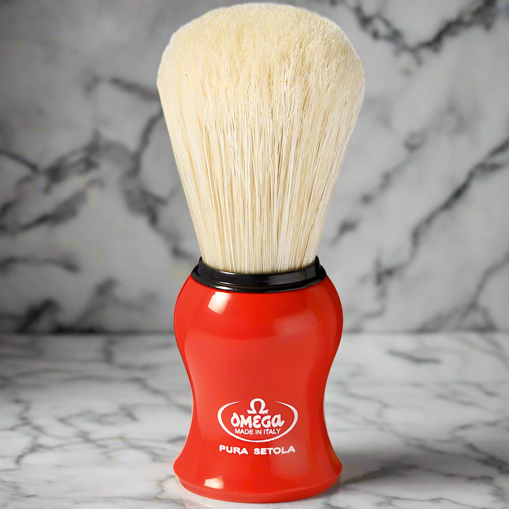 Topher's Beard and Soap Co. Omega Pura Setola Shaving Brush – classic Italian-made boar bristle brush with bright red ergonomic handle, displayed on a marble background