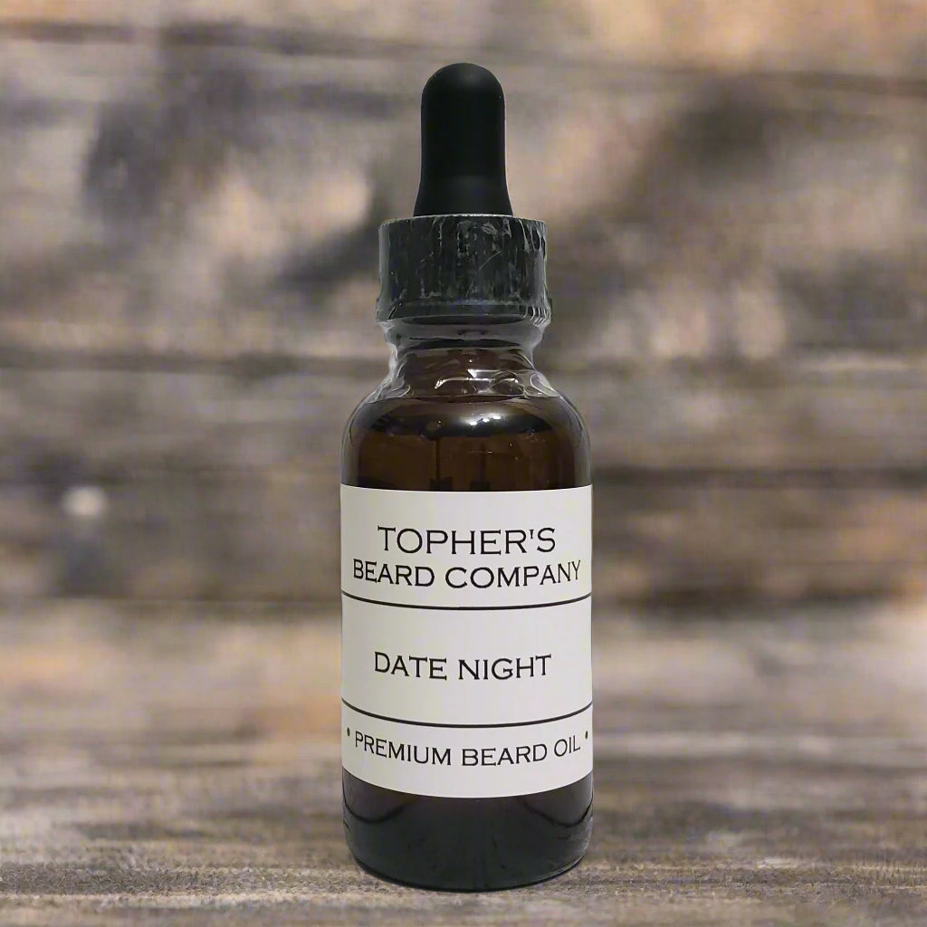Date Night Premium Beard Oil bottle on a marble counter with greenery in the background – smooth, seductive scent for soft, touchable beards.