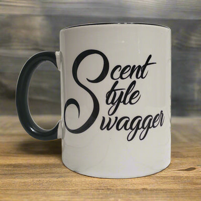 White 11 oz ceramic mug from Tophers Beard Co. in Brantford, Ontario, with a black inner glaze and handle, featuring the black text "Scent. Style. Swagger." printed using a durable sublimation method.