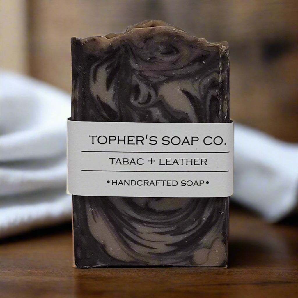 Tophers Soap Co. Tabac + Leather handcrafted soap, a marbled brown and tan bar with a rugged yet refined tobacco and leather scent, made in Brantford, Ontario.