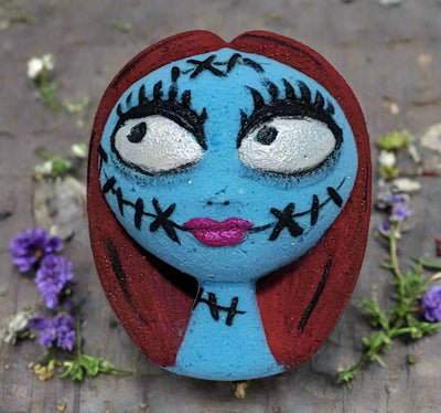 Sally bath bomb: hand-painted with intricate details, Sugar Cookie scented, and inspired by The Nightmare Before Christmas. From Tophers Soap Co.