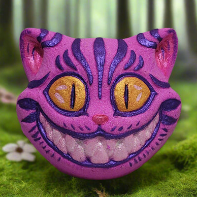 Cheshire Cat bath bomb: hand-painted with vibrant colors, bergamot and mandarin scented, and inspired by Alice in Wonderland. From Tophers Soap Co.
