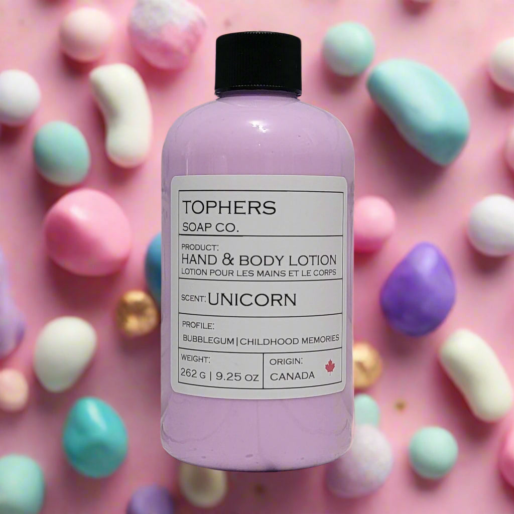 Light purple bottle of Tophers Soap Co. Unicorn Hand & Body Lotion with a black pump, featuring a label that describes the scent as "Bubblegum | Childhood Memories," surrounded by colorful pastel candies, indicating a fun and naturally-formulated lotion originating from Canada.