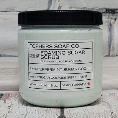 Peppermint Cookie Sugar scrub in plastic jar on white brick background | Tophers Soap Co