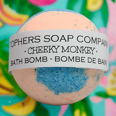 Cheeky Monkey bath bomb from Tophers Soap Co.: a fun and fruity bath experience with a vibrant peach and blue swirl. Made in Brantford, Ontario.